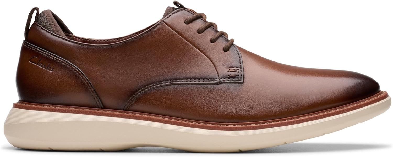 Pavo Monitor Arm installed on a wooden desk with cables organized